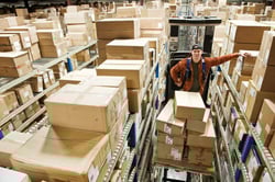 a-warehouse-worker-standing-on-a-motorized-stock-p-2023-11-27-05-28-36-utc