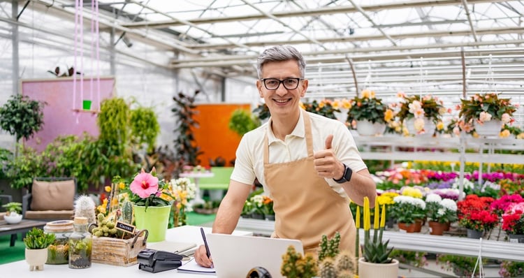 florist-at-the-flower-shop-s-counter-2025-06-04-18-42-19-utc-1