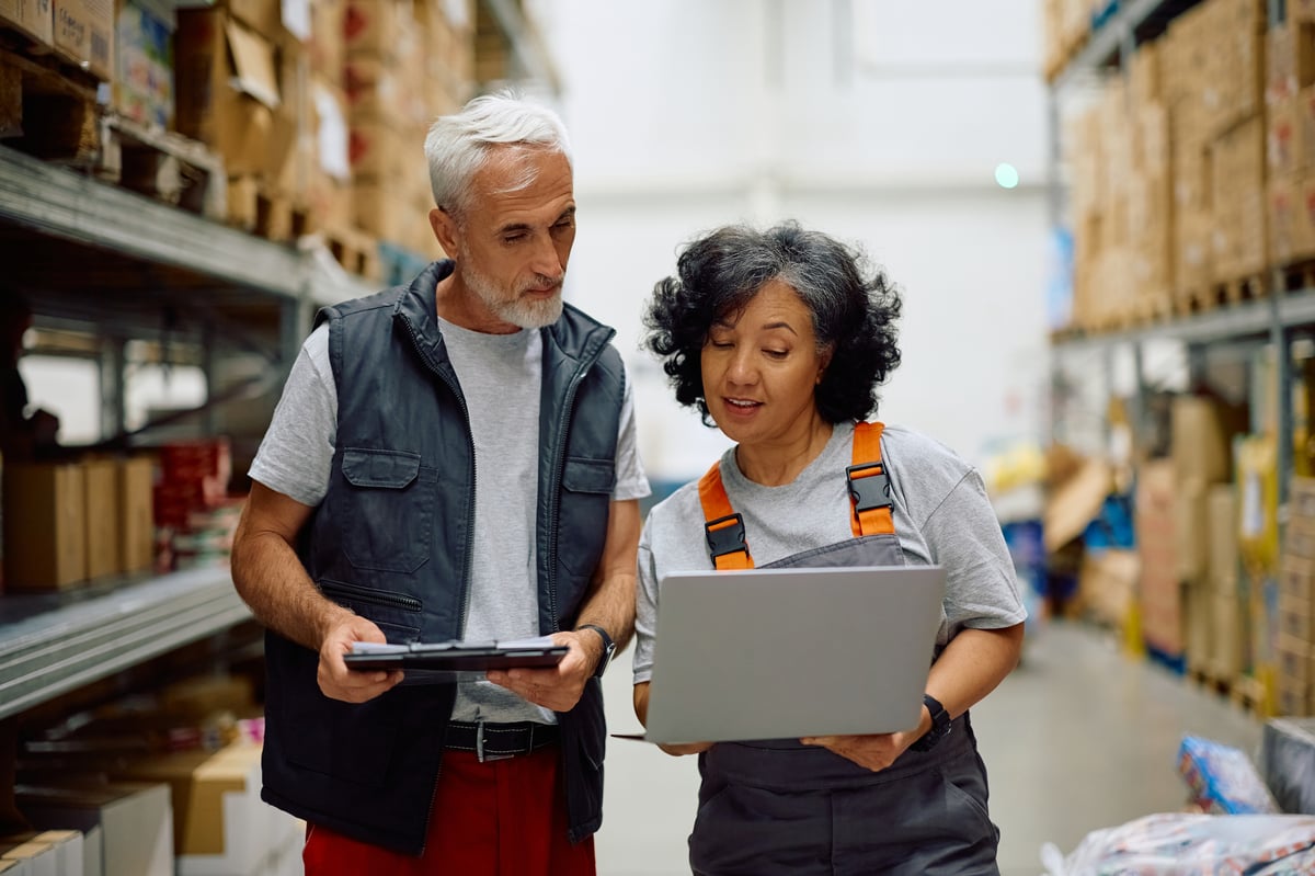 mature worker and her colleague working on inventory management