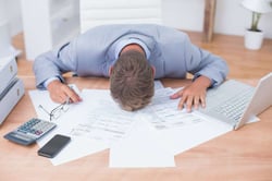 blog.windwardsoftware.comhubfsBusinessman being depressed by accounting in his office