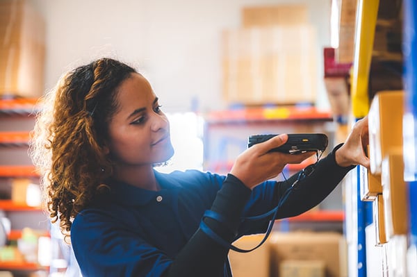 warehouse-worker-using-bar-code-scanner-to-analyze